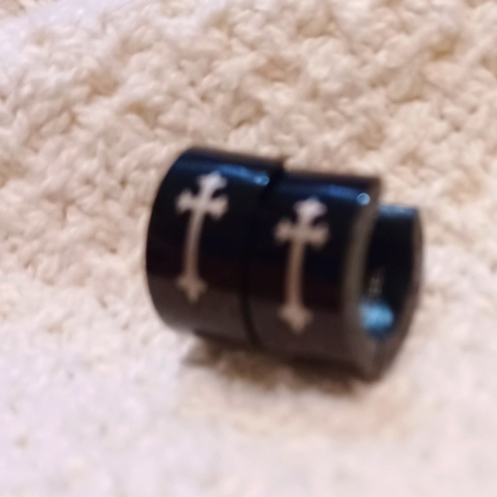 Black Cuff Like Eearrings Pierced With Gold Cross.